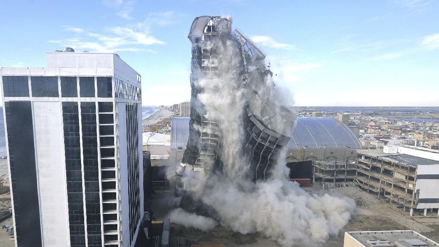 The former Trump Plaza Hotel & Casino implodes in Atlantic City, N.J., Wednesday, Feb 17, 2021.The former Trump Plaza casino was imploded after falling into such disrepair that chunks of the building began peeling off and crashing to the ground.  (Edward Lea/The Press of Atlantic City via AP)