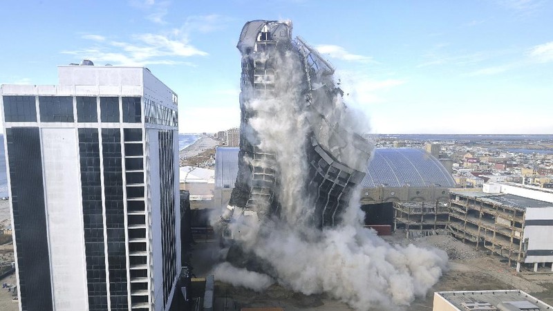 The former Trump Plaza Hotel & Casino implodes in Atlantic City, N.J., Wednesday, Feb 17, 2021.The former Trump Plaza casino was imploded after falling into such disrepair that chunks of the building began peeling off and crashing to the ground.  (Edward Lea/The Press of Atlantic City via AP)