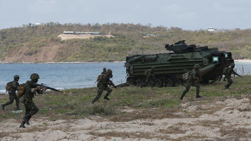Thai soldiers take their position in front of an amphibious assault vehicle after landing during the ongoing Cobra Gold U.S.-Thai joint military exercise on Hat Yao beach in Chonburi province, eastern Thailand, Saturday, Feb. 16, 2019. Cobra Gold military exercise is the biggest activity of its type in the Asia-Pacific region with 29 nations taking part as participants or observers. (AP Photo/Sakchai Lalit)