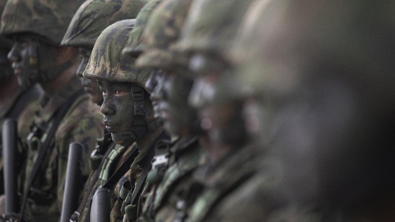 Thai soldiers take their position in front of an amphibious assault vehicle after landing during the ongoing Cobra Gold U.S.-Thai joint military exercise on Hat Yao beach in Chonburi province, eastern Thailand, Saturday, Feb. 16, 2019. Cobra Gold military exercise is the biggest activity of its type in the Asia-Pacific region with 29 nations taking part as participants or observers. (AP Photo/Sakchai Lalit)