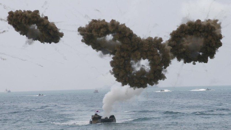 Thai soldiers take their position in front of an amphibious assault vehicle after landing during the ongoing Cobra Gold U.S.-Thai joint military exercise on Hat Yao beach in Chonburi province, eastern Thailand, Saturday, Feb. 16, 2019. Cobra Gold military exercise is the biggest activity of its type in the Asia-Pacific region with 29 nations taking part as participants or observers. (AP Photo/Sakchai Lalit)