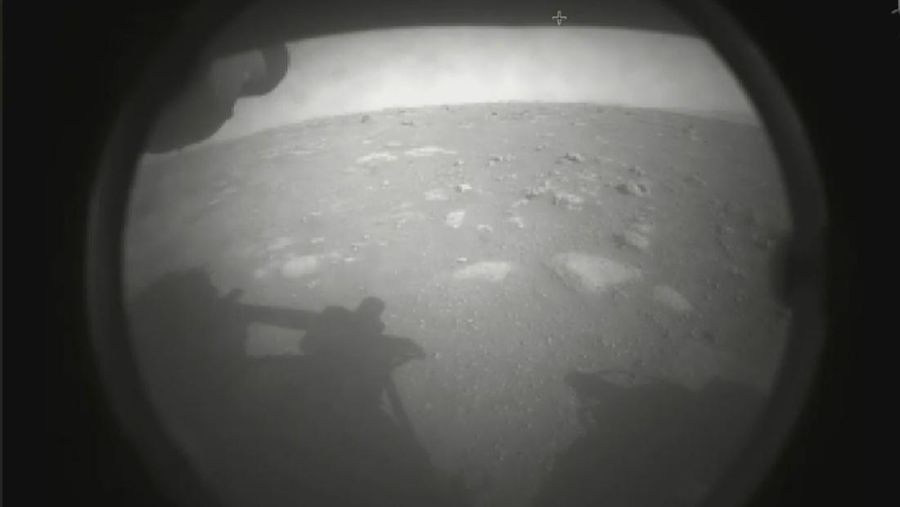 This photo made available by NASA shows the first image sent by the Perseverance rover showing the surface of Mars, just after landing in the Jezero crater, on Thursday, Feb. 18, 2021. (NASA via AP)