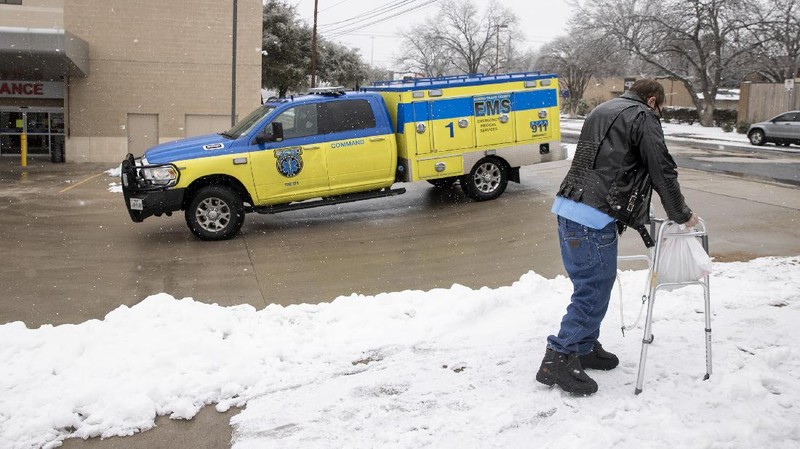 FILE - In this Feb. 16, 2021 file photo, People wait in a long line to buy groceries at H-E-B in Austin, Texas, during an extreme cold snap and widespread power outage. A series of winter storms and widespread power outages gripping Texas and other states not used to such extreme low temperatures are creating big challenges in the nation’s food supply networks. (Jay Janner/Austin American-Statesman via AP, File)