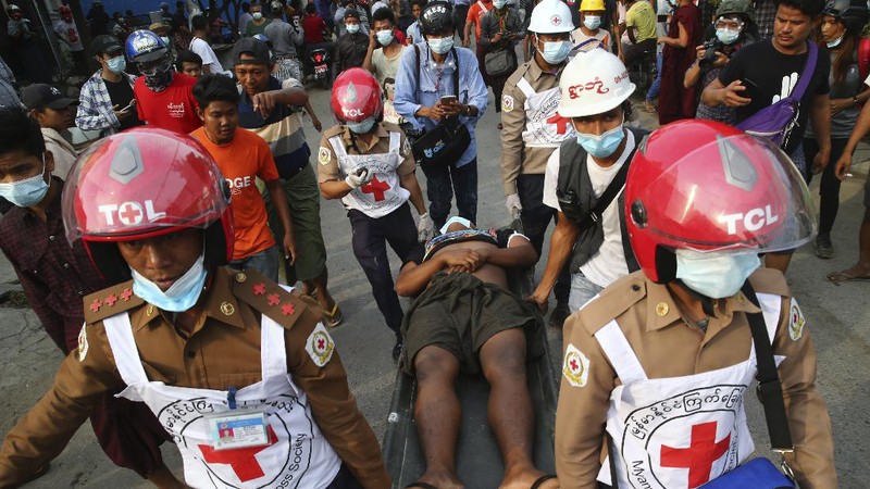 A police truck uses a water cannon to disperse protesters in Mandalay, Myanmar, on Saturday, Feb. 20, 2021. Security forces in Myanmar ratcheted up their pressure against anti-coup protesters Saturday, using water cannons, tear gas, slingshots and rubber bullets against demonstrators and striking dock workers in Mandalay, the nation's second-largest city. (AP Photos)