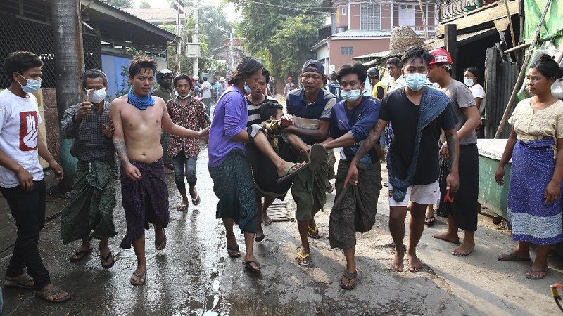 A police truck uses a water cannon to disperse protesters in Mandalay, Myanmar, on Saturday, Feb. 20, 2021. Security forces in Myanmar ratcheted up their pressure against anti-coup protesters Saturday, using water cannons, tear gas, slingshots and rubber bullets against demonstrators and striking dock workers in Mandalay, the nation's second-largest city. (AP Photos)