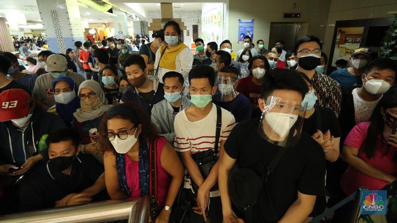 Anti-coup protesters hold signs that read 