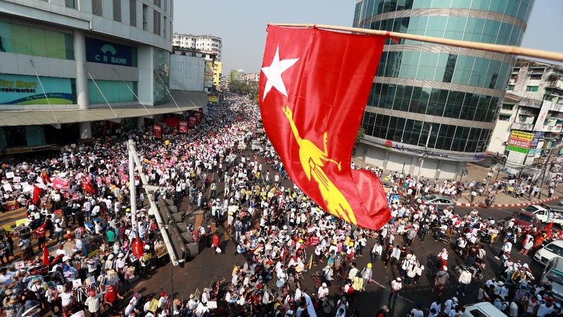 Anti-coup protesters fill the main road during a rally in Mandalay, Myanmar Monday, Feb. 22, 2021. A call for a Monday general strike by demonstrators in Myanmar protesting the military's seizure of power has been met by the ruling junta with a thinly veiled threat to use lethal force, raising the possibility of major clashes.(AP Photo)