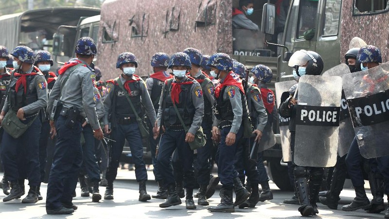 Anti-coup protesters fill the main road during a rally in Mandalay, Myanmar Monday, Feb. 22, 2021. A call for a Monday general strike by demonstrators in Myanmar protesting the military's seizure of power has been met by the ruling junta with a thinly veiled threat to use lethal force, raising the possibility of major clashes.(AP Photo)