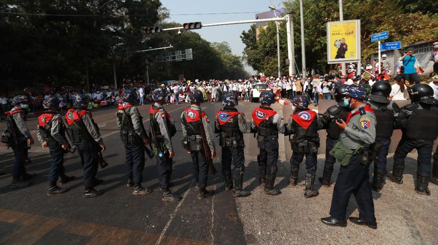 Anti-coup protesters fill the main road during a rally in Mandalay, Myanmar Monday, Feb. 22, 2021. A call for a Monday general strike by demonstrators in Myanmar protesting the military's seizure of power has been met by the ruling junta with a thinly veiled threat to use lethal force, raising the possibility of major clashes.(AP Photo)