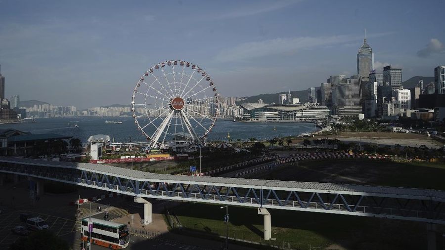 The Hong Kong Observation Wheel is seen at waterfront in Hong Kong, Thursday, Oct. 15, 2020. Hong Kong and Singapore say they have agreed to a bilateral air travel bubble, re-establishing travel links as coronavirus infections in both cities decline. (AP Photo/Kin Cheung)
