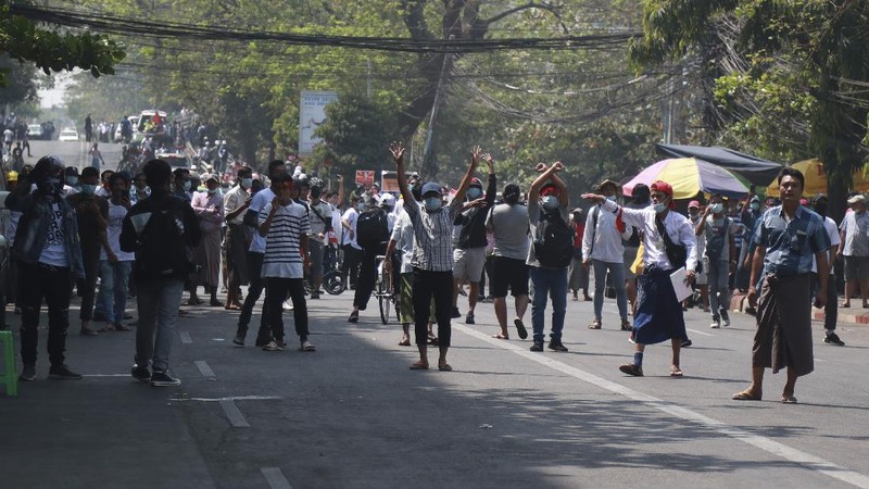 A protester show bullets, shotgun shells and rubber bullets used by security forces during a demonstration against the military coup in Mandalay, Myanmar, Friday, Feb. 26, 2021. (AP Photo)