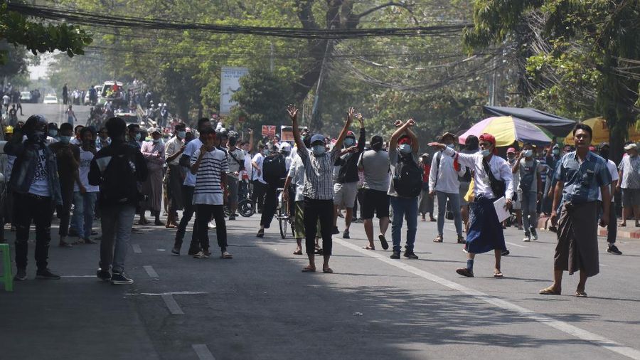 A protester show bullets, shotgun shells and rubber bullets used by security forces during a demonstration against the military coup in Mandalay, Myanmar, Friday, Feb. 26, 2021. (AP Photo)