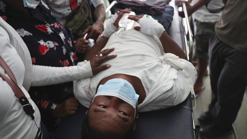 A protester show bullets, shotgun shells and rubber bullets used by security forces during a demonstration against the military coup in Mandalay, Myanmar, Friday, Feb. 26, 2021. (AP Photo)