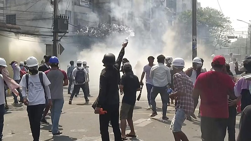 Protesters block a road during a protest against the military coup in Mandalay, Myanmar, Sunday, Feb. 28, 2021. Police in Myanmar escalated their crackdown on demonstrators against this month's military takeover, deploying early and in force on Saturday as protesters sought to assemble in the country's two biggest cities and elsewhere. (AP Photo)
