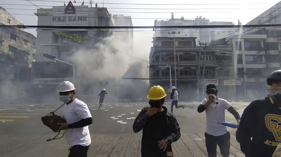 Protesters block a road during a protest against the military coup in Mandalay, Myanmar, Sunday, Feb. 28, 2021. Police in Myanmar escalated their crackdown on demonstrators against this month's military takeover, deploying early and in force on Saturday as protesters sought to assemble in the country's two biggest cities and elsewhere. (AP Photo)