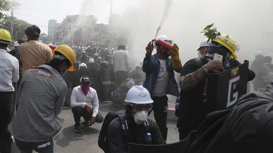 Protesters march on main road during an anti-coup demonstration in Mandalay, Myanmar, Sunday, March 7, 2021. The escalation of violence in Myanmar as authorities crack down on protests against the Feb. 1 coup is raising pressure for more sanctions against the junta, even as countries struggle over how to best sway military leaders inured to global condemnation. (AP Photo)