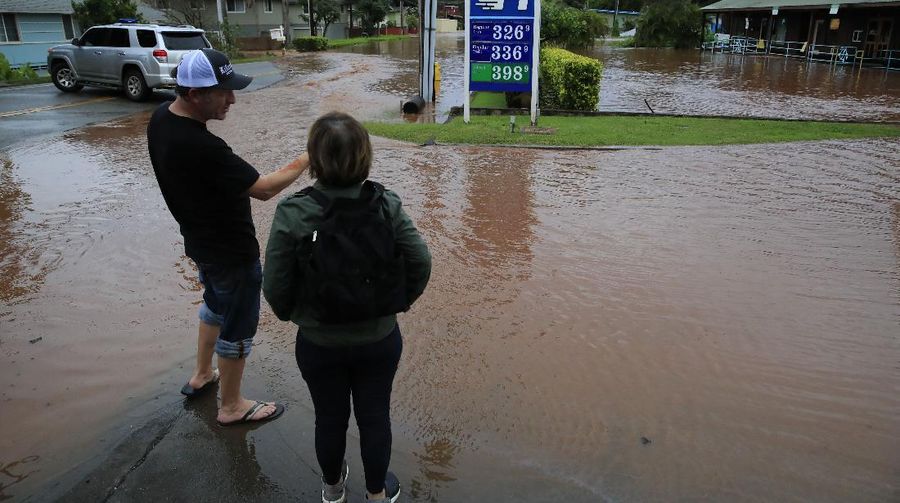 A house on Haleiwa Road is surrounded by floodwaters Tuesday, March 9, 2021, in Haleiwa, Hawaii. Torrential rains have inundated parts of Hawaii for the past several days. (Jamm Aquino/Honolulu Star-Advertiser via AP)