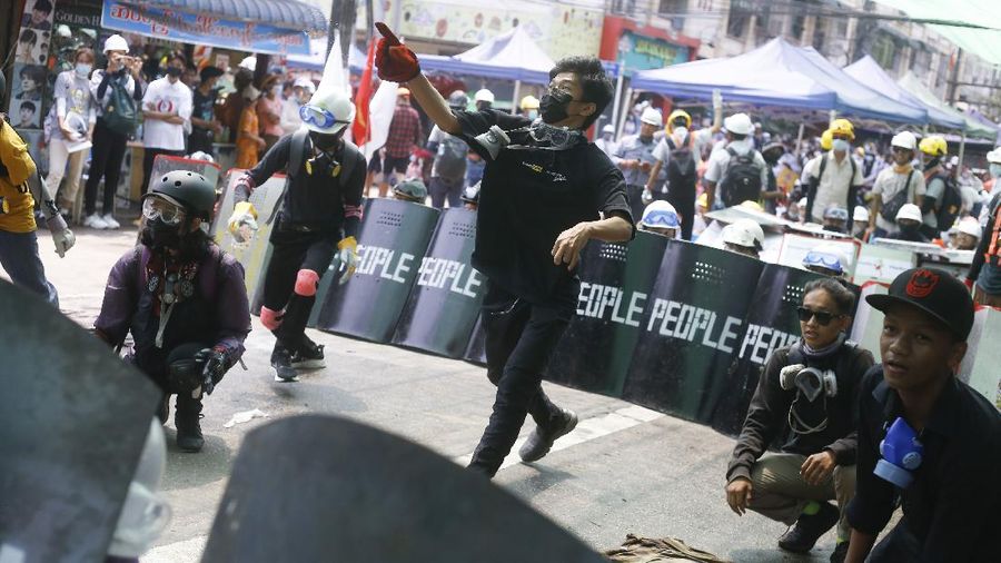 Riot police officers hold down a protester as they disperse protesters in Tharkata Township on the outskirts of Yangon, Myanmar, Saturday, March 6, 2021. The U.N. special envoy for Myanmar on Friday called for urgent Security Council action, saying multiple peaceful protesters were killed and injured in the military's worst crackdowns this week. (AP Photo)