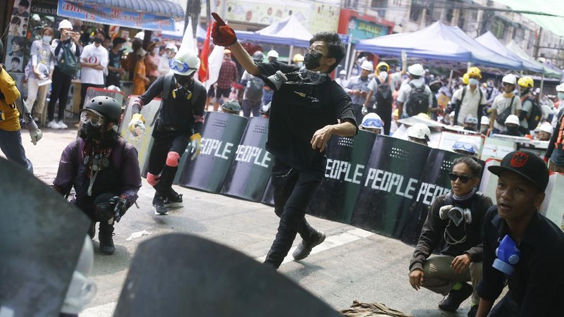 Riot police officers hold down a protester as they disperse protesters in Tharkata Township on the outskirts of Yangon, Myanmar, Saturday, March 6, 2021. The U.N. special envoy for Myanmar on Friday called for urgent Security Council action, saying multiple peaceful protesters were killed and injured in the military's worst crackdowns this week. (AP Photo)