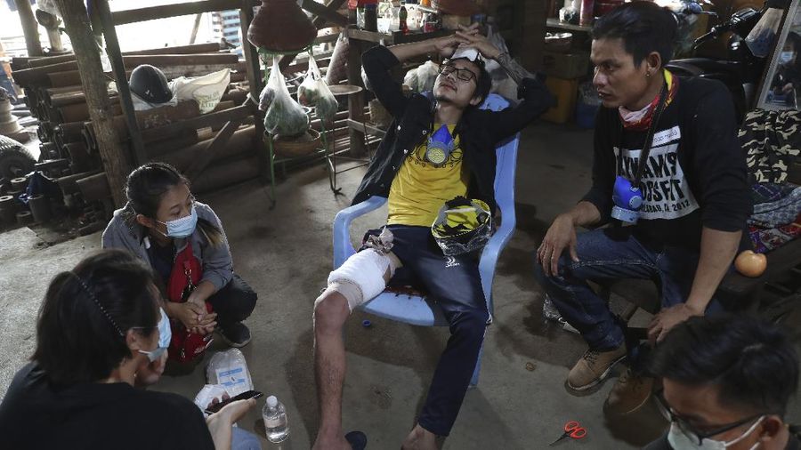 Riot police officers hold down a protester as they disperse protesters in Tharkata Township on the outskirts of Yangon, Myanmar, Saturday, March 6, 2021. The U.N. special envoy for Myanmar on Friday called for urgent Security Council action, saying multiple peaceful protesters were killed and injured in the military's worst crackdowns this week. (AP Photo)