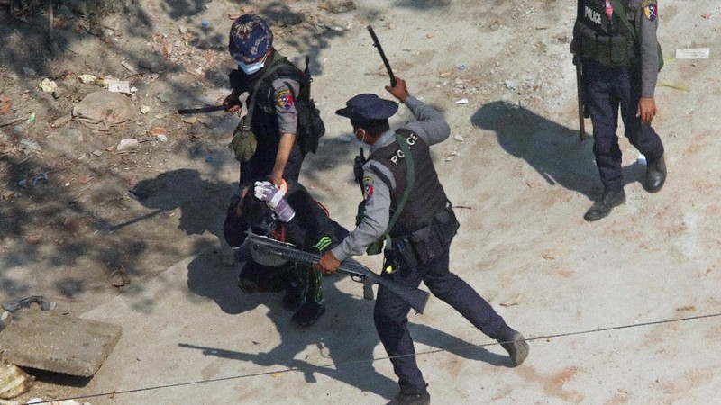 Riot police officers hold down a protester as they disperse protesters in Tharkata Township on the outskirts of Yangon, Myanmar, Saturday, March 6, 2021. The U.N. special envoy for Myanmar on Friday called for urgent Security Council action, saying multiple peaceful protesters were killed and injured in the military's worst crackdowns this week. (AP Photo)
