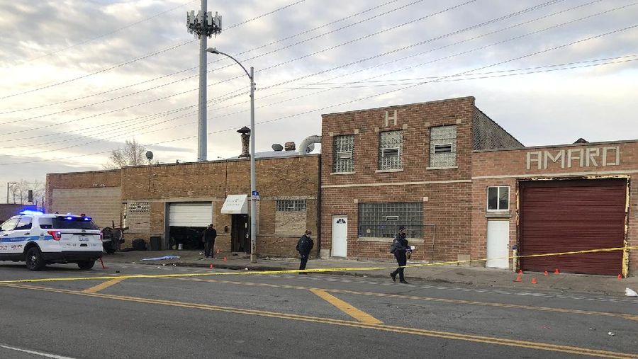 Chicago police work  the scene of a fatal shooting early Sunday, March 14, 2021, in the Park Manor neighborhood of Chicago. Authorities say gunfire erupted at a party on Chicago’s South Side early Sunday morning.  (Erin Hooley /Chicago Tribune via AP)