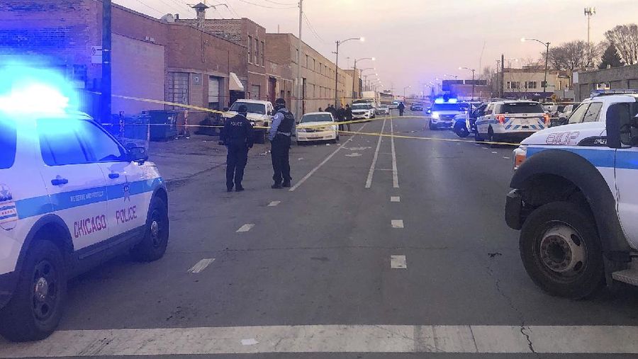 Chicago police work  the scene of a fatal shooting early Sunday, March 14, 2021, in the Park Manor neighborhood of Chicago. Authorities say gunfire erupted at a party on Chicago’s South Side early Sunday morning.  (Erin Hooley /Chicago Tribune via AP)