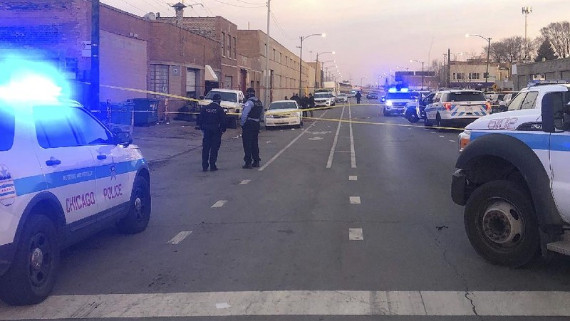 Chicago police work  the scene of a fatal shooting early Sunday, March 14, 2021, in the Park Manor neighborhood of Chicago. Authorities say gunfire erupted at a party on Chicago’s South Side early Sunday morning.  (Erin Hooley /Chicago Tribune via AP)