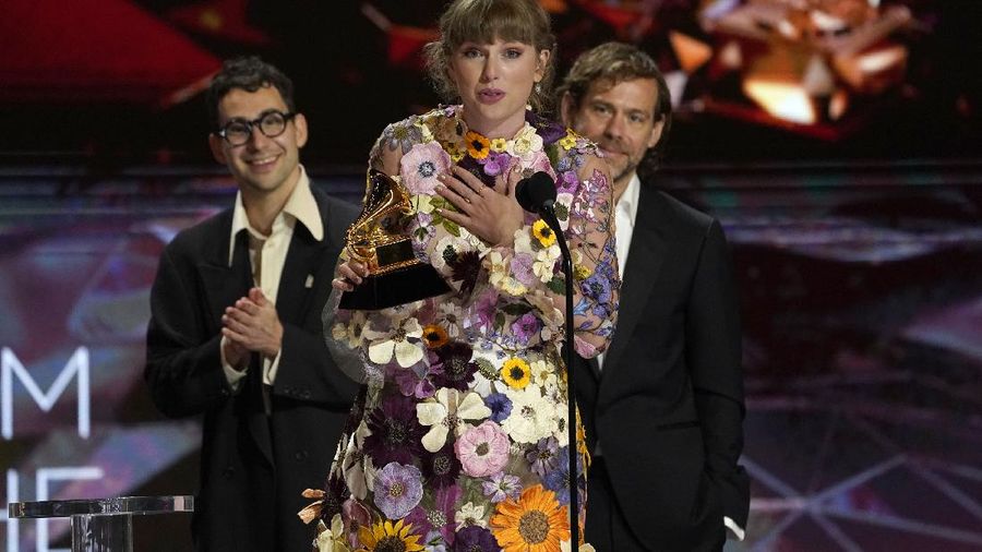 Taylor Swift accepts the award for album of the year for