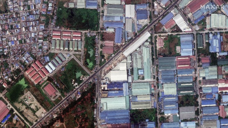This combination image of March 9, 2021, top, and March 15, 2021, satellite images provided Maxar Technologies shows Global Fashion Garment Factory, a Chinese-owned supplier to the fashion retailer C&A, in Yangon, Myanmar. Attacks on Chinese-run factories in Myanmar's biggest city drew demands from Beijing for protection for their property and employees, while many in Myanmar expressed outrage over China's apparent lack of concern for those killed in protests against last month's military coup. (©2021 Maxar Technologies via AP)
