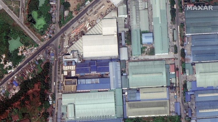 This combination image of March 9, 2021, top, and March 15, 2021, satellite images provided Maxar Technologies shows Global Fashion Garment Factory, a Chinese-owned supplier to the fashion retailer C&A, in Yangon, Myanmar. Attacks on Chinese-run factories in Myanmar's biggest city drew demands from Beijing for protection for their property and employees, while many in Myanmar expressed outrage over China's apparent lack of concern for those killed in protests against last month's military coup. (©2021 Maxar Technologies via AP)
