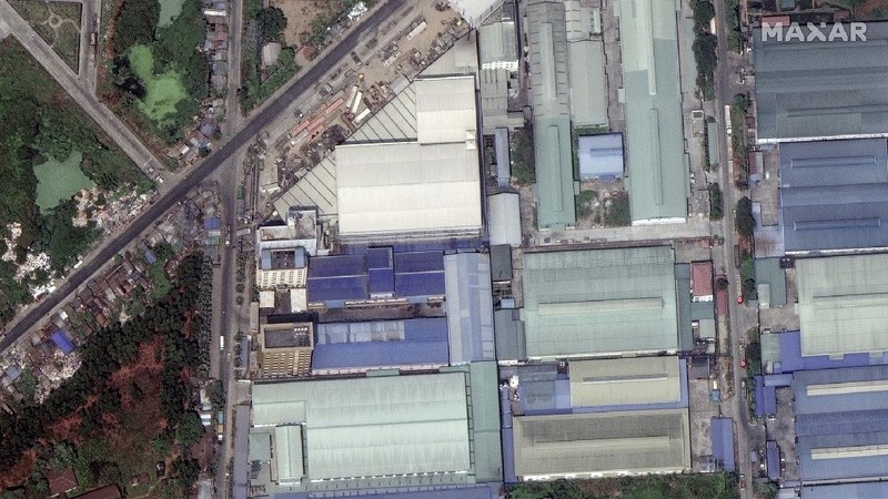 This combination image of March 9, 2021, top, and March 15, 2021, satellite images provided Maxar Technologies shows Global Fashion Garment Factory, a Chinese-owned supplier to the fashion retailer C&A, in Yangon, Myanmar. Attacks on Chinese-run factories in Myanmar's biggest city drew demands from Beijing for protection for their property and employees, while many in Myanmar expressed outrage over China's apparent lack of concern for those killed in protests against last month's military coup. (©2021 Maxar Technologies via AP)