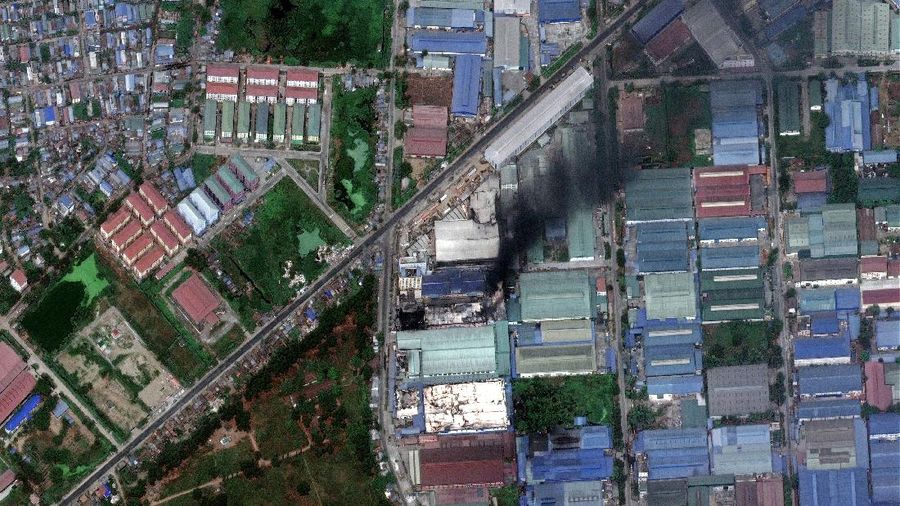 This combination image of March 9, 2021, top, and March 15, 2021, satellite images provided Maxar Technologies shows Global Fashion Garment Factory, a Chinese-owned supplier to the fashion retailer C&A, in Yangon, Myanmar. Attacks on Chinese-run factories in Myanmar's biggest city drew demands from Beijing for protection for their property and employees, while many in Myanmar expressed outrage over China's apparent lack of concern for those killed in protests against last month's military coup. (©2021 Maxar Technologies via AP)