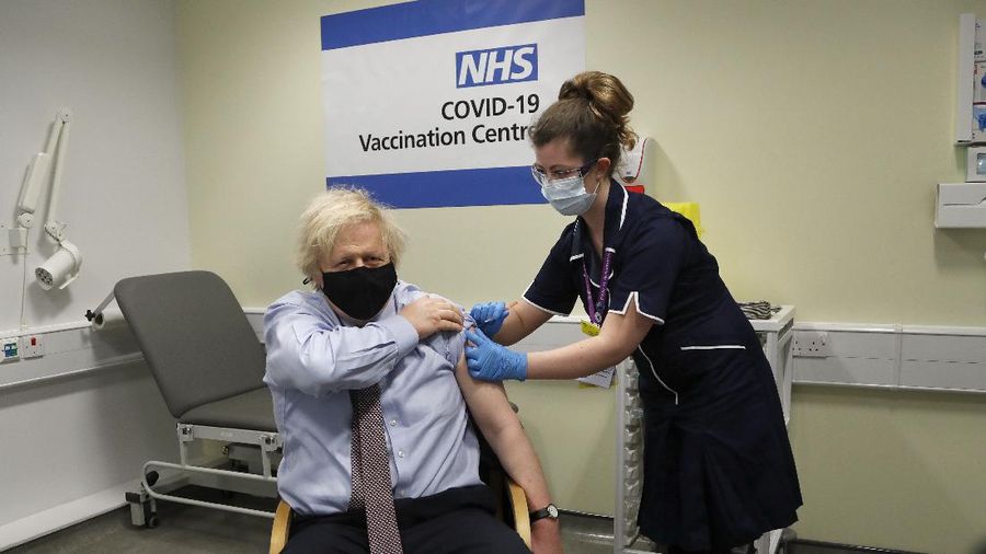 Britain's Prime Minister Boris Johnson receives the first dose of the AstraZeneca vaccine administered by nurse and Clinical Pod Lead, Lily Harrington at St. Thomas' Hospital in London, Friday, March 19, 2021. Johnson is one of several politicians across Europe, including French Prime Minister Jean Castex, getting a shot of the AstraZeneca vaccine on Friday. (AP Photo/Frank Augstein, Pool)