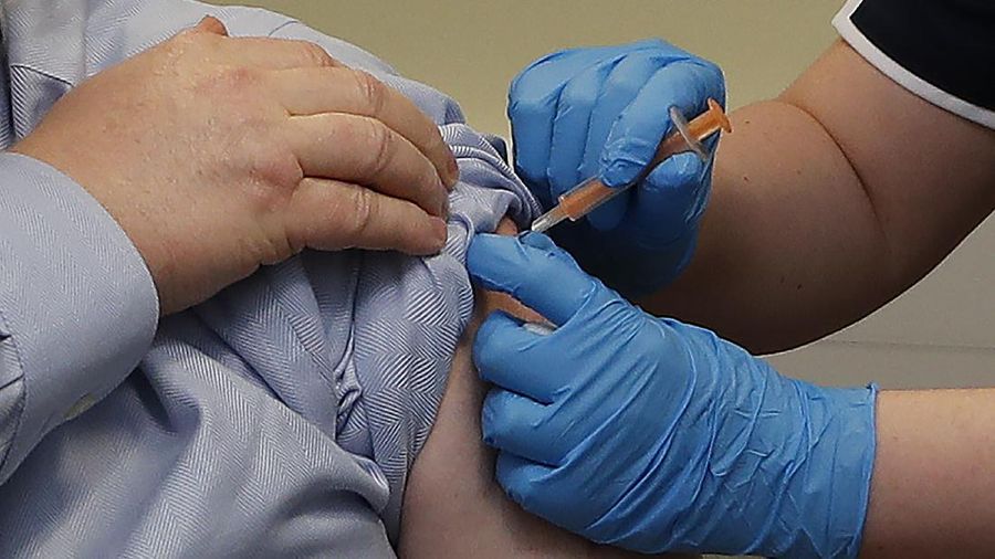 Britain's Prime Minister Boris Johnson receives the first dose of the AstraZeneca vaccine administered by nurse and Clinical Pod Lead, Lily Harrington at St. Thomas' Hospital in London, Friday, March 19, 2021. Johnson is one of several politicians across Europe, including French Prime Minister Jean Castex, getting a shot of the AstraZeneca vaccine on Friday. (AP Photo/Frank Augstein, Pool)