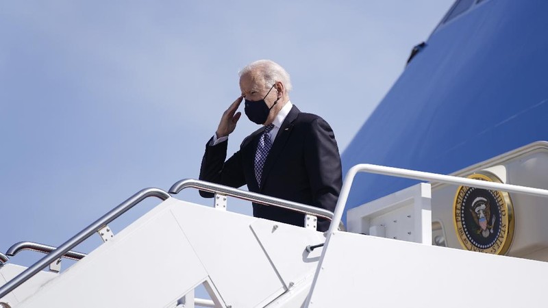 President Joe Biden recovers after stumbling while boarding Air Force One at Andrews Air Force Base, Md., Friday, March 19, 2021. Biden is en route to Georgia. (AP Photo/Patrick Semansky)