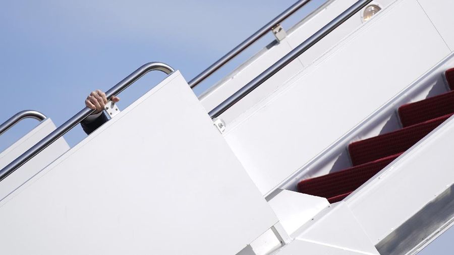President Joe Biden recovers after stumbling while boarding Air Force One at Andrews Air Force Base, Md., Friday, March 19, 2021. Biden is en route to Georgia. (AP Photo/Patrick Semansky)