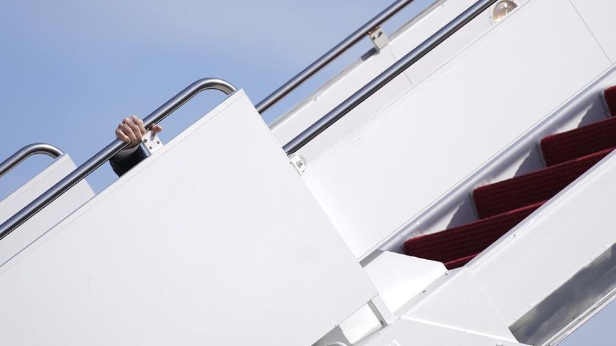 President Joe Biden recovers after stumbling while boarding Air Force One at Andrews Air Force Base, Md., Friday, March 19, 2021. Biden is en route to Georgia. (AP Photo/Patrick Semansky)