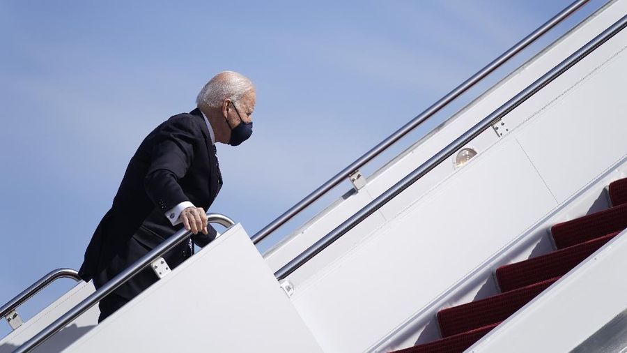 President Joe Biden recovers after stumbling while boarding Air Force One at Andrews Air Force Base, Md., Friday, March 19, 2021. Biden is en route to Georgia. (AP Photo/Patrick Semansky)