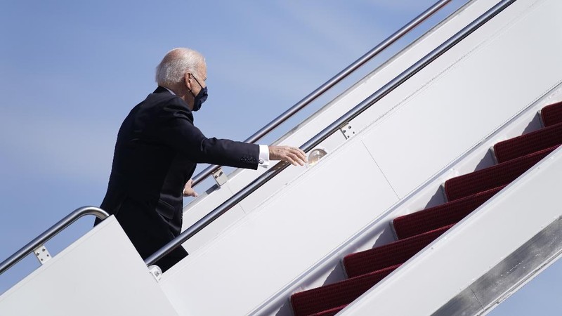President Joe Biden recovers after stumbling while boarding Air Force One at Andrews Air Force Base, Md., Friday, March 19, 2021. Biden is en route to Georgia. (AP Photo/Patrick Semansky)