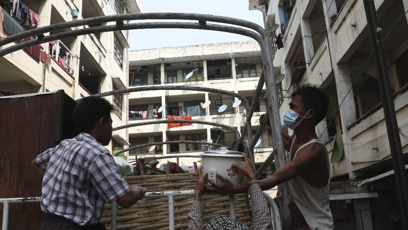 State railway employees load their belongings after being evicted from their home Saturday, March 20, 2021, in Mandalay, Myanmar. State railway workers in Mandalay have been threatened with eviction to force them to end their support for the Civil Disobedience Movement (CDM) against military rule. (AP Photo)