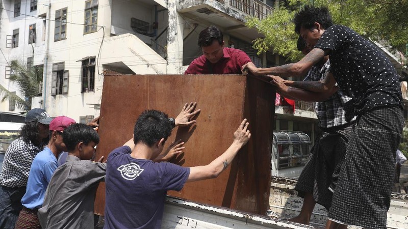 State railway employees load their belongings after being evicted from their home Saturday, March 20, 2021, in Mandalay, Myanmar. State railway workers in Mandalay have been threatened with eviction to force them to end their support for the Civil Disobedience Movement (CDM) against military rule. (AP Photo)