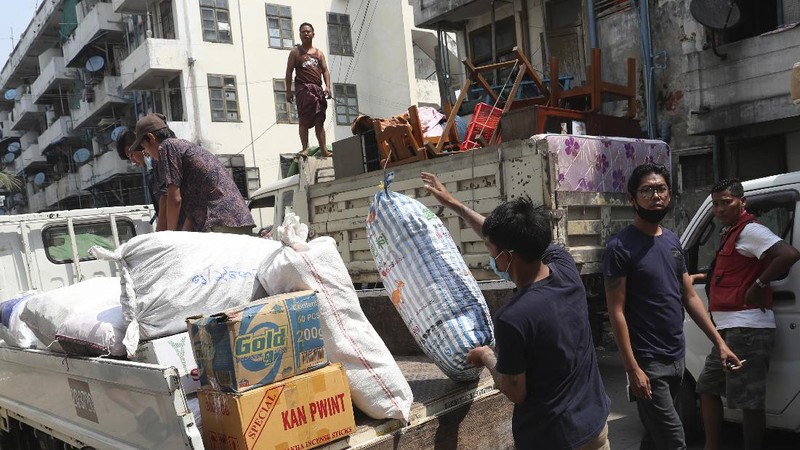 State railway employees load their belongings after being evicted from their home Saturday, March 20, 2021, in Mandalay, Myanmar. State railway workers in Mandalay have been threatened with eviction to force them to end their support for the Civil Disobedience Movement (CDM) against military rule. (AP Photo)
