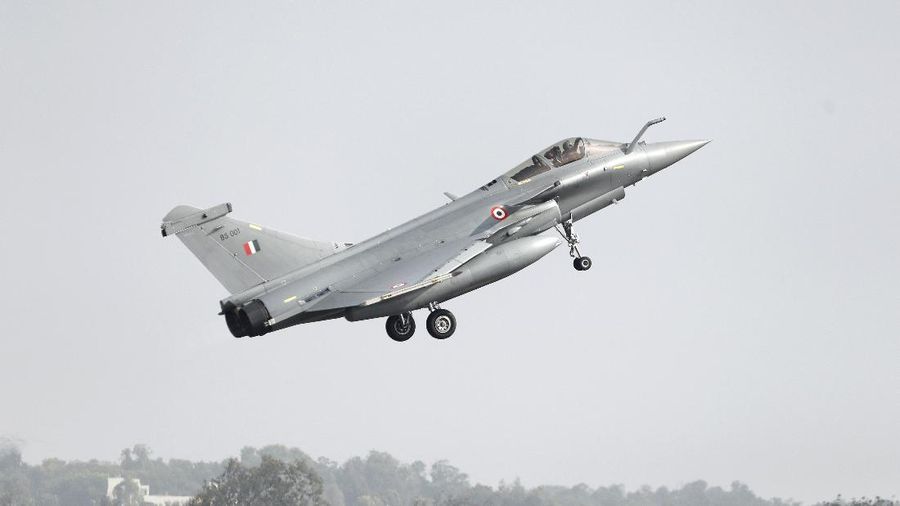 A French-made Rafale fighter jet takes off on the inaugural day of the Aero India 2021 at Yelahanka air base in Bengaluru, India, Wednesday, Feb. 3, 2021. Aero India is a biennial event where aviation companies display their products and technology. (AP Photo/Aijaz Rahi)