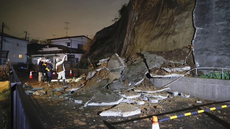 A collapsed section of a cliff is seen in Shiogama, Miyagi Prefecture, northern Japan Saturday March 20, 2021, after a powerful earthquake struck northeastern Japan. A strong earthquake struck Saturday off northern Japan, shaking buildings even in Tokyo and triggering a tsunami advisory for a part of the northern coast. (Kyodo News via AP)