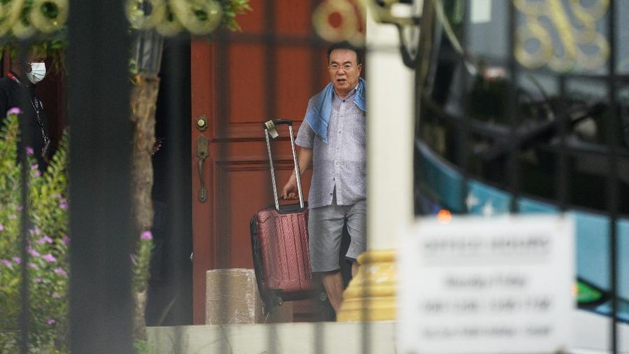 A bus carrying staffs of the North Korean embassy leaves the embassy compound in Kuala Lumpur, Sunday, March 21, 2021. Malaysia on Friday ordered all North Korean diplomats to leave the country within 48 hours, an escalation of a diplomatic spat over Malaysia's move to extradite a North Korean suspect to the United States on money laundering charges. (AP Photo/Vincent Thian)