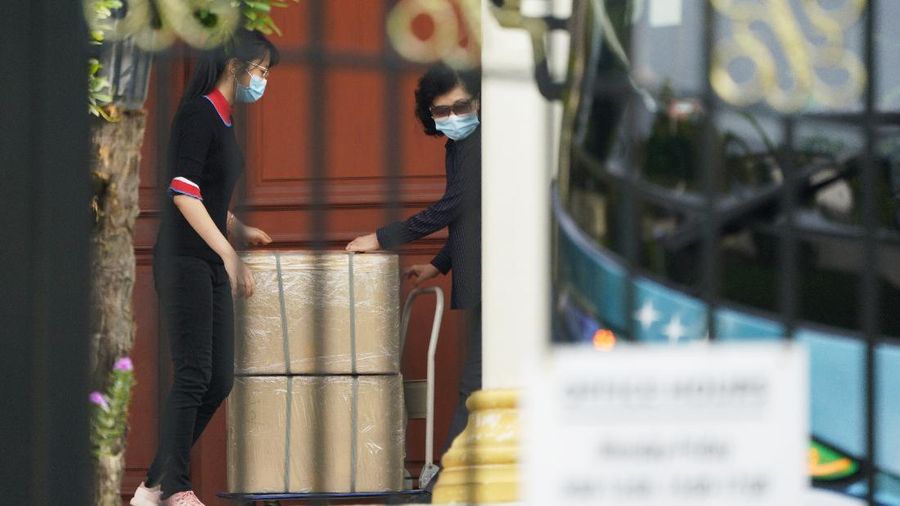 A bus carrying staffs of the North Korean embassy leaves the embassy compound in Kuala Lumpur, Sunday, March 21, 2021. Malaysia on Friday ordered all North Korean diplomats to leave the country within 48 hours, an escalation of a diplomatic spat over Malaysia's move to extradite a North Korean suspect to the United States on money laundering charges. (AP Photo/Vincent Thian)