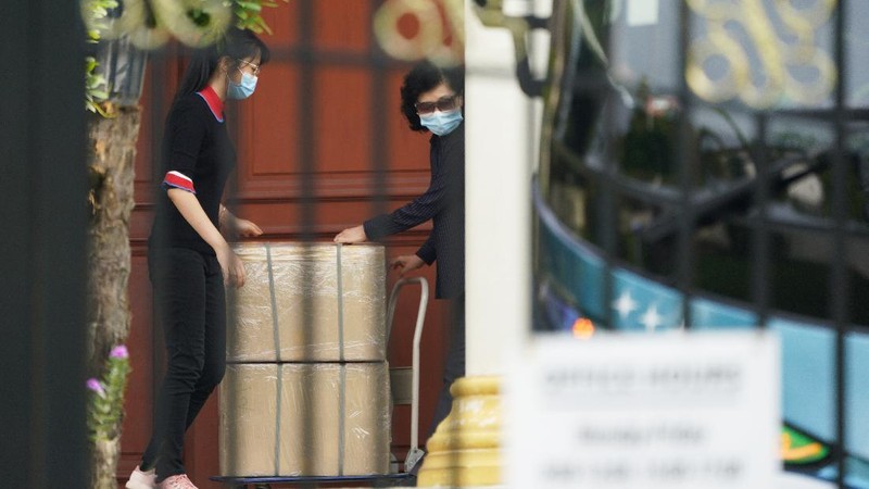 A bus carrying staffs of the North Korean embassy leaves the embassy compound in Kuala Lumpur, Sunday, March 21, 2021. Malaysia on Friday ordered all North Korean diplomats to leave the country within 48 hours, an escalation of a diplomatic spat over Malaysia's move to extradite a North Korean suspect to the United States on money laundering charges. (AP Photo/Vincent Thian)