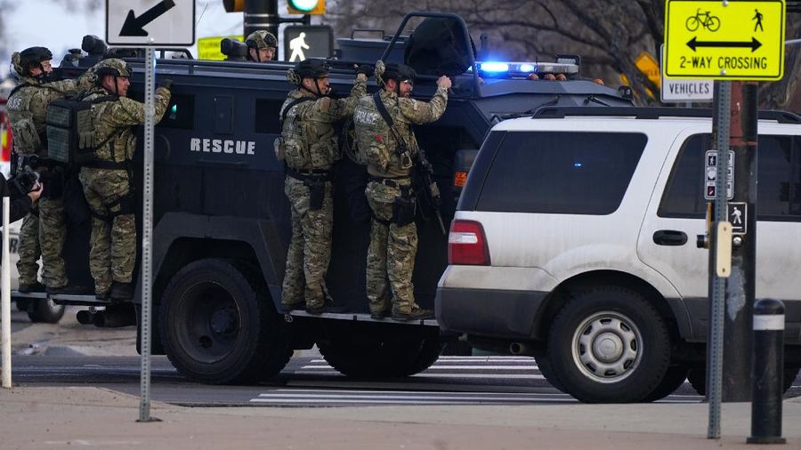 Police work on the scene outside of a King Soopers grocery store where a shooting took place Monday, March 22, 2021, in Boulder, Colo. (AP Photo/David Zalubowski)