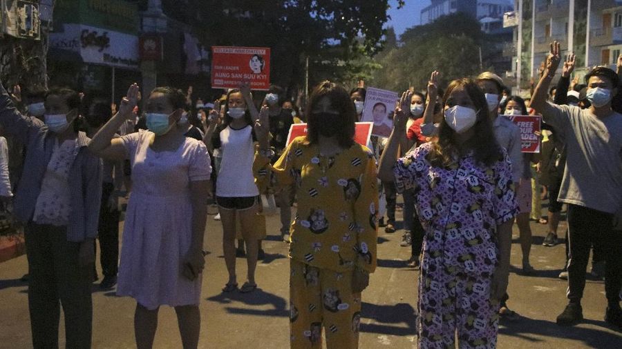 Anti-coup protesters hold red balloon, calling for foreign intervention to aid them in downtown Yangon, Myanmar, Monday, March 22, 2021. Protests against the coup continued in cities and town across the country, including Mandalay and Yangon. (AP Photo)
